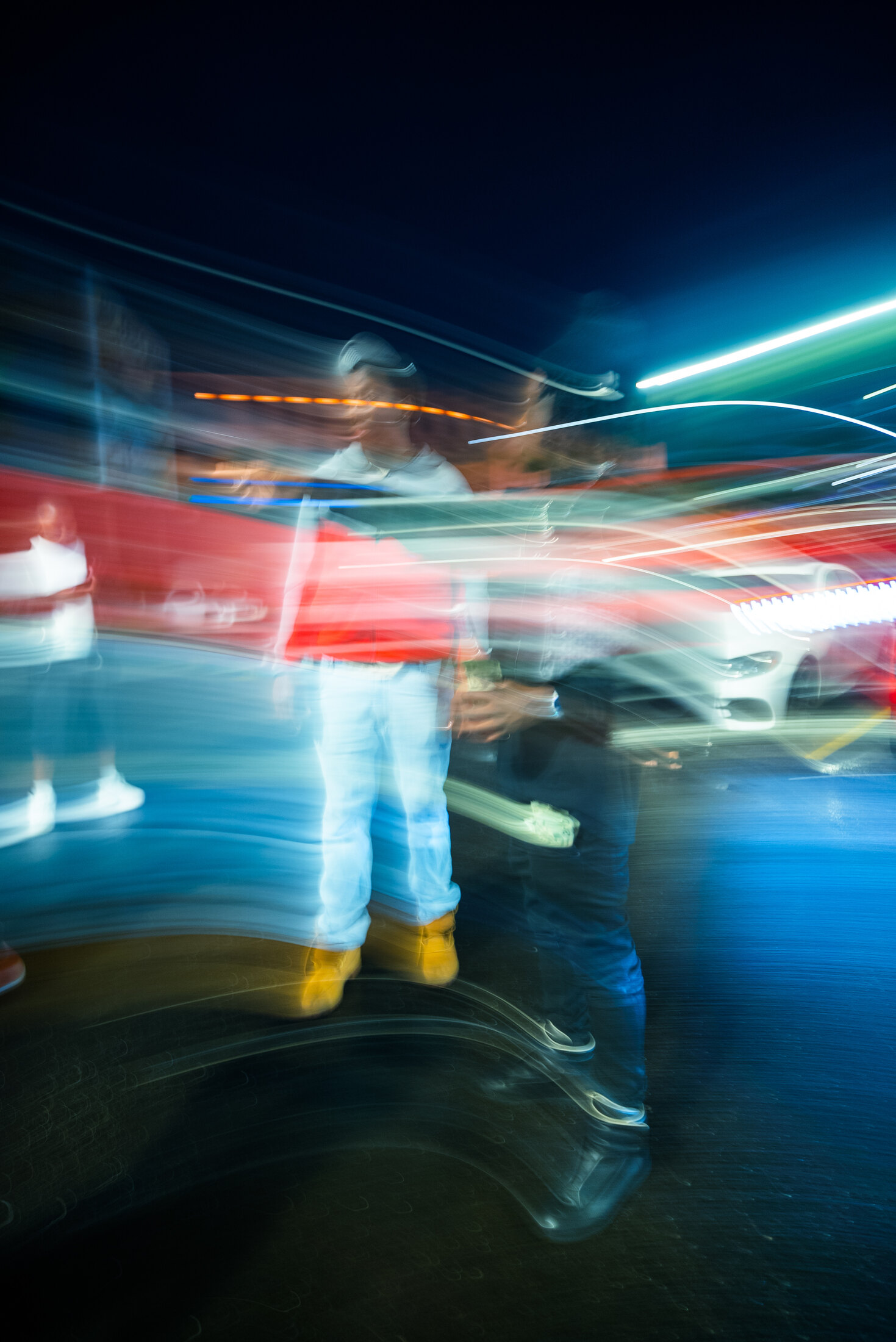 Distorted long-exposure portrait in a parking lot