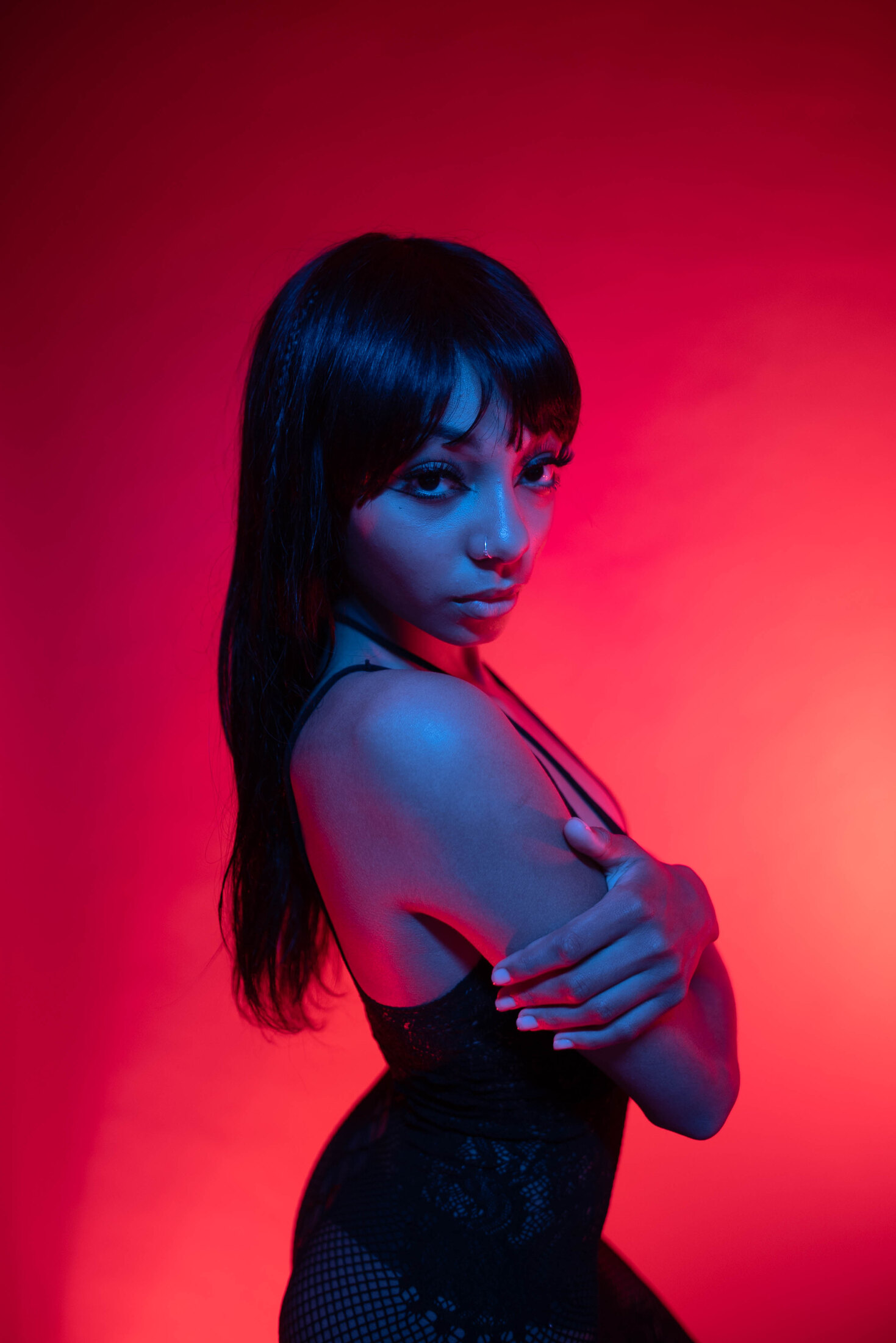 Portrait under saturated red and blue light