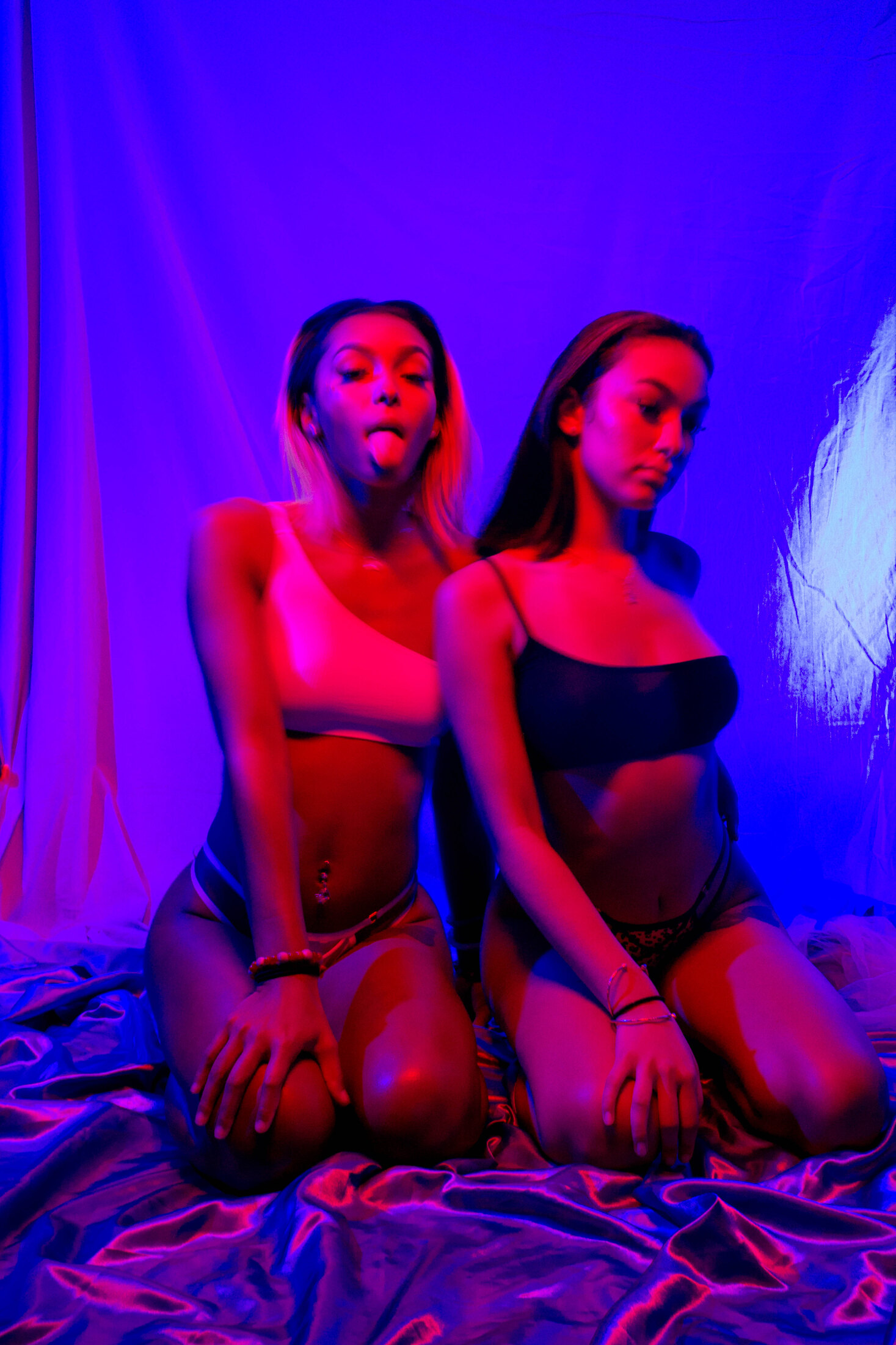 Two-person portrait under purple light
