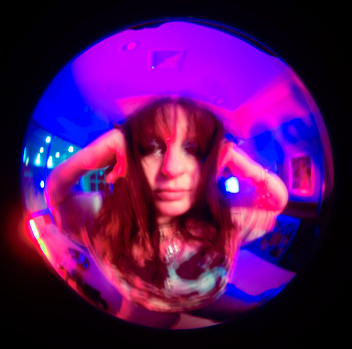 Fisheye portrait in an arcade
