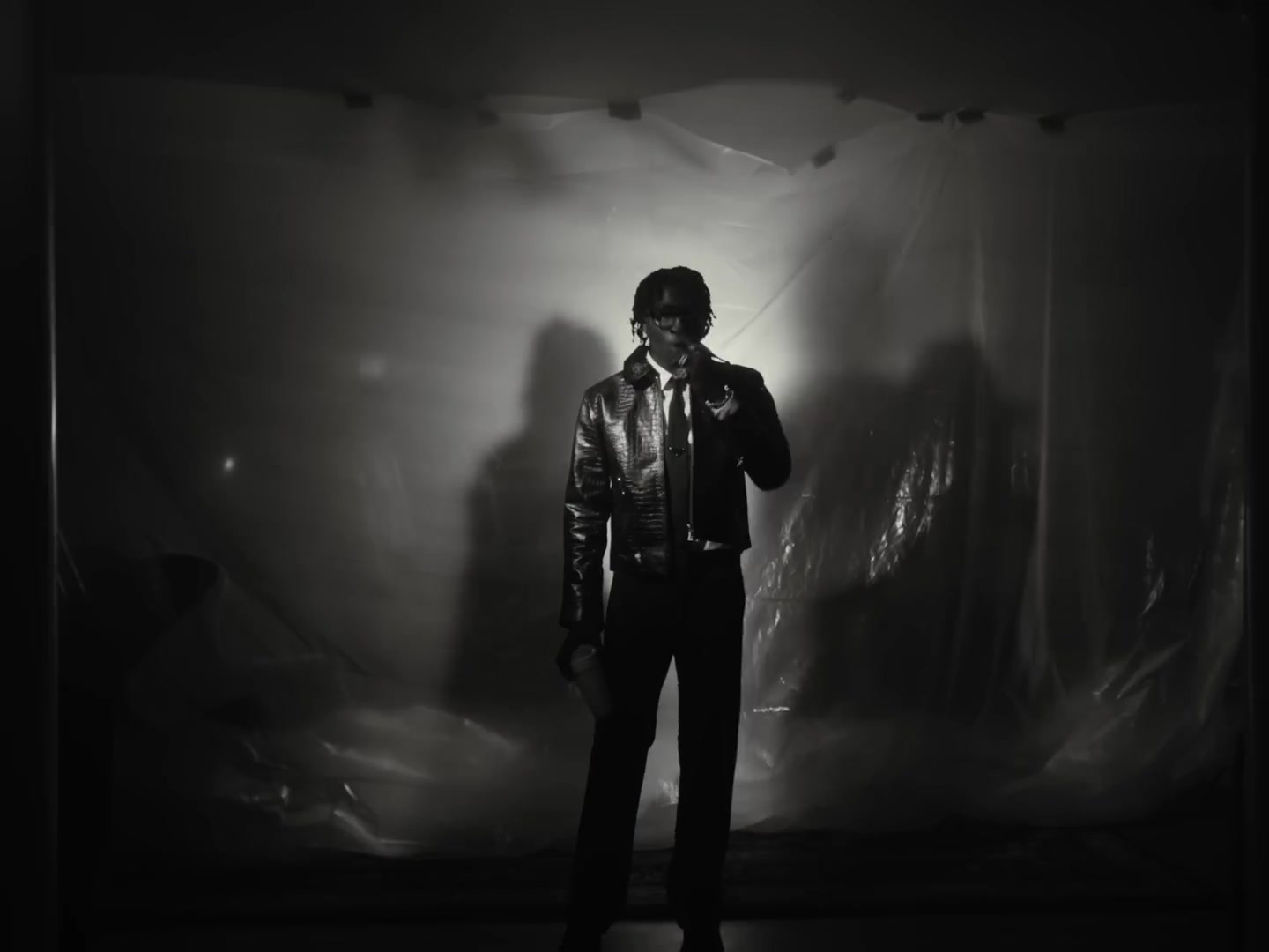 Black-and-white backlit film still from Came A Long Way by Nino Paid